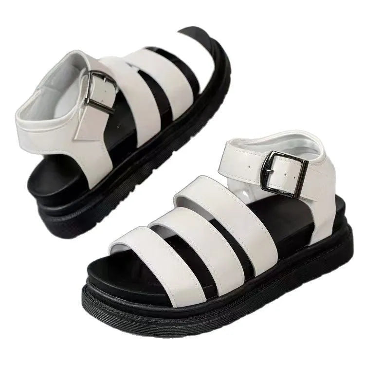 Black outdoor sandals with thick rubber soles and adjustable buckle straps showing fish mouth round toe design