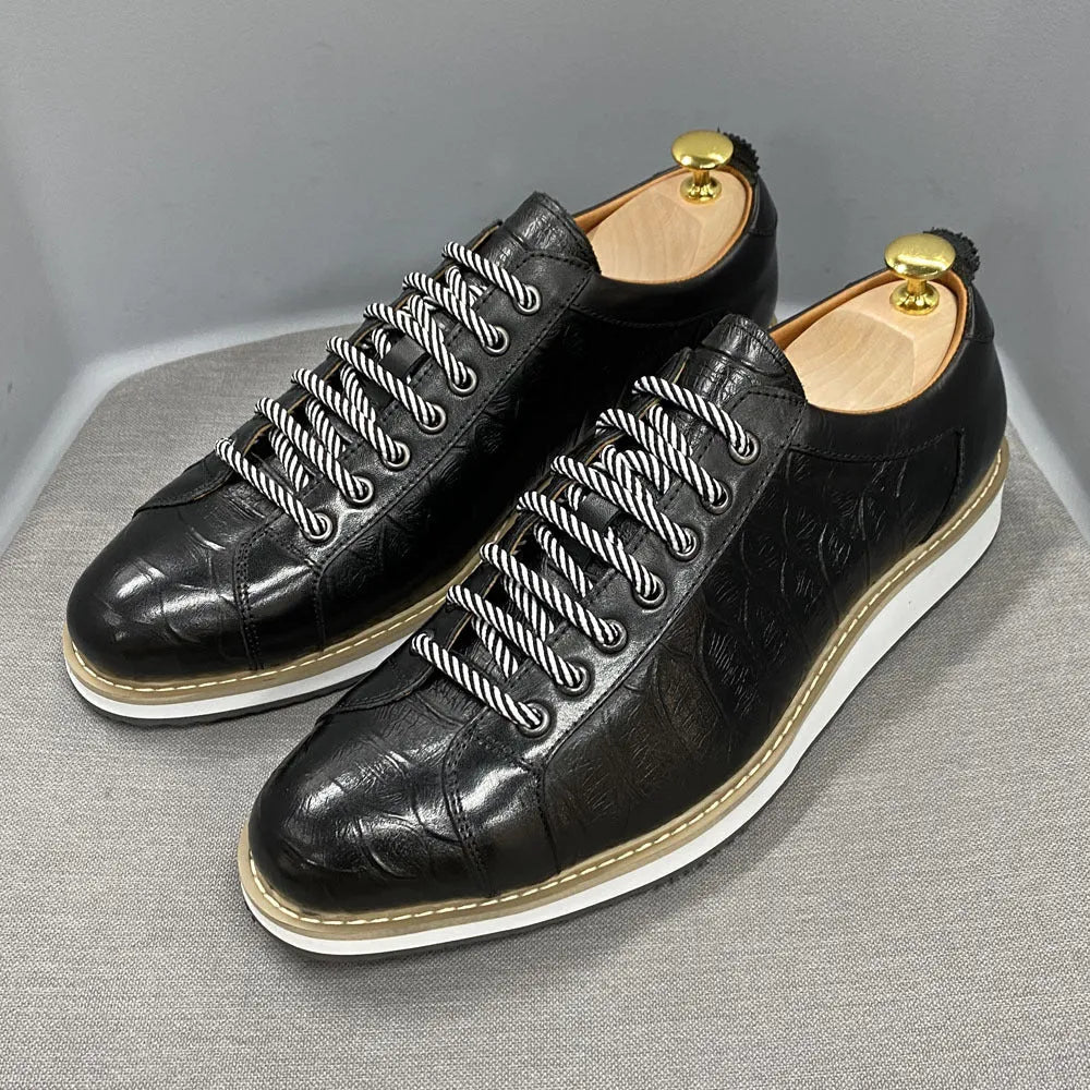 Men's white low-top casual shoes with a patterned embossed upper and front lace closure.