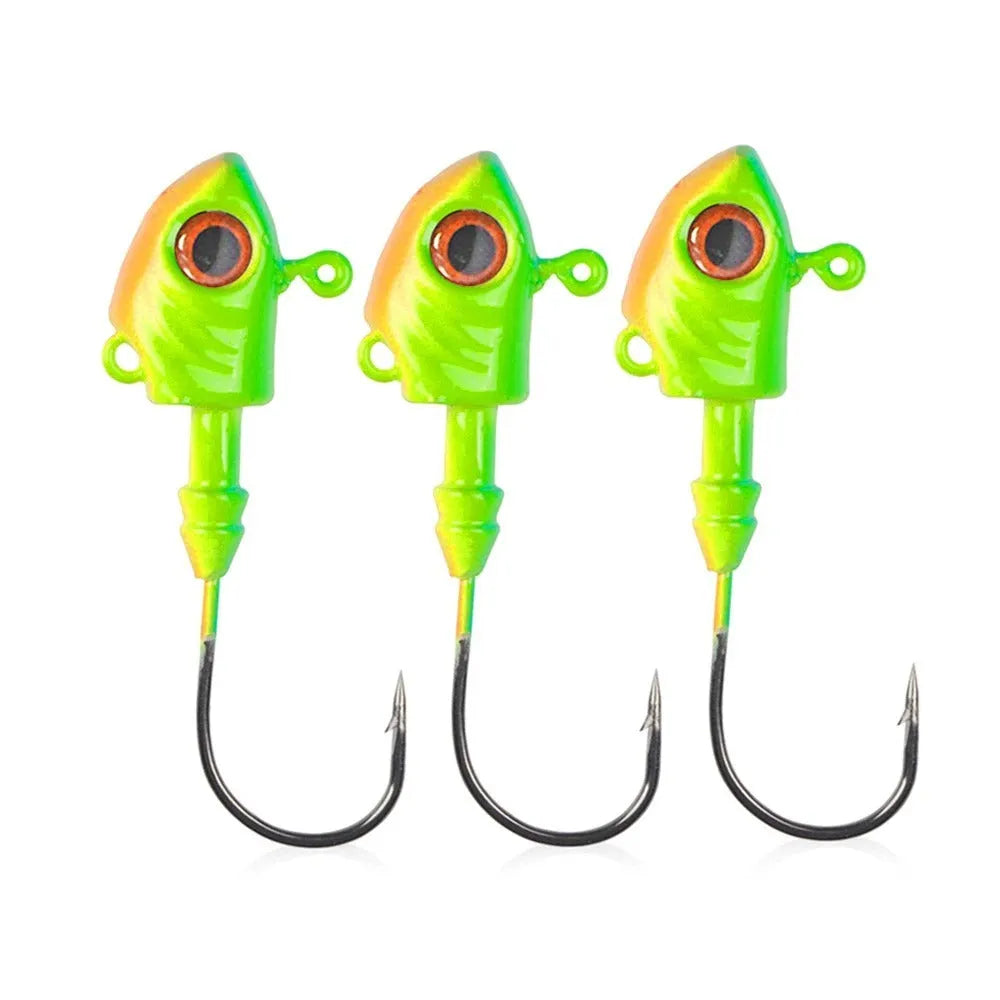 Simulation Yayu shaped lead head fishing jig hooks in blue, silver, yellow colours on a tackle background.