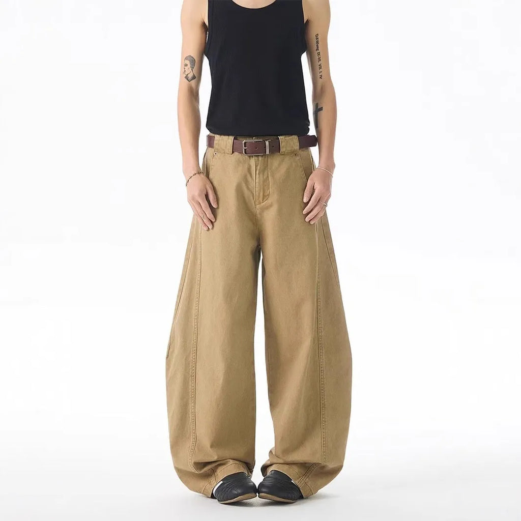 Brown loose-fit straight-leg men's jeans with a button fly and mid-rise waist.