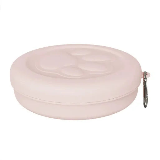 Portable dog feeding bowl with a separate snack box attached, shown in light green and pink colour options.