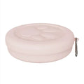 Portable dog feeding bowl with a separate snack box attached, shown in light green and pink colour options.