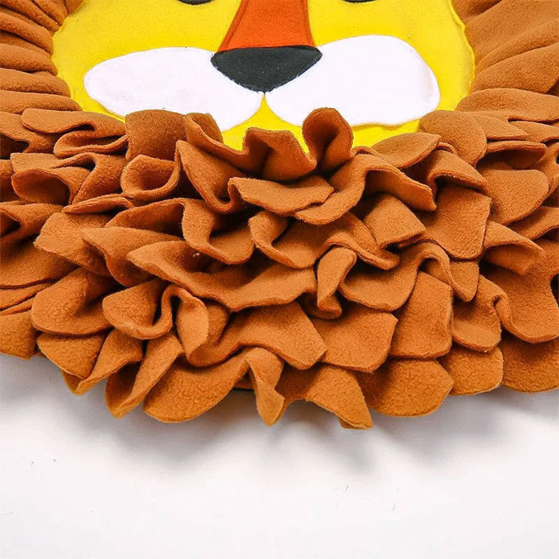 Brown lion-pattern snuffle mat for dogs and cats on a floor, showing plush hiding sections.