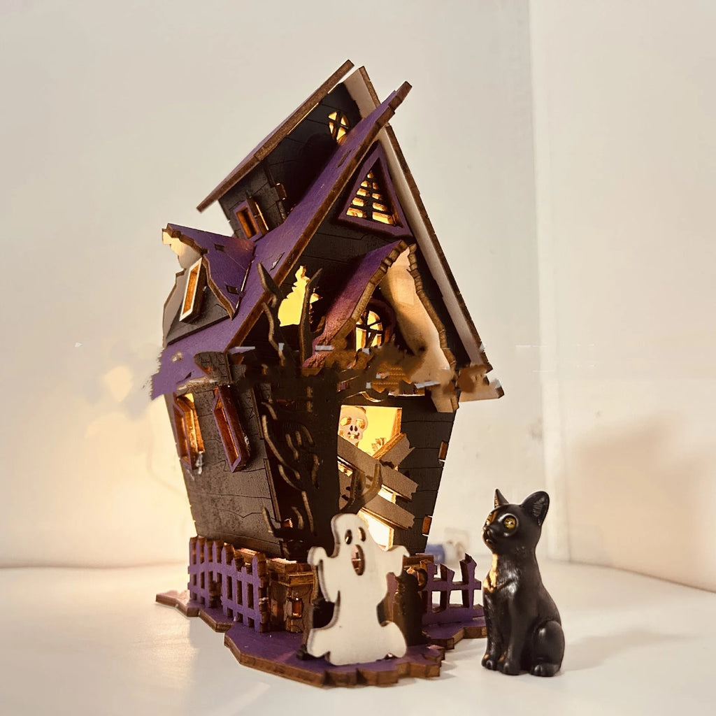 Wooden Halloween haunted house table decoration with luminous glowing design measuring 14 cm wide