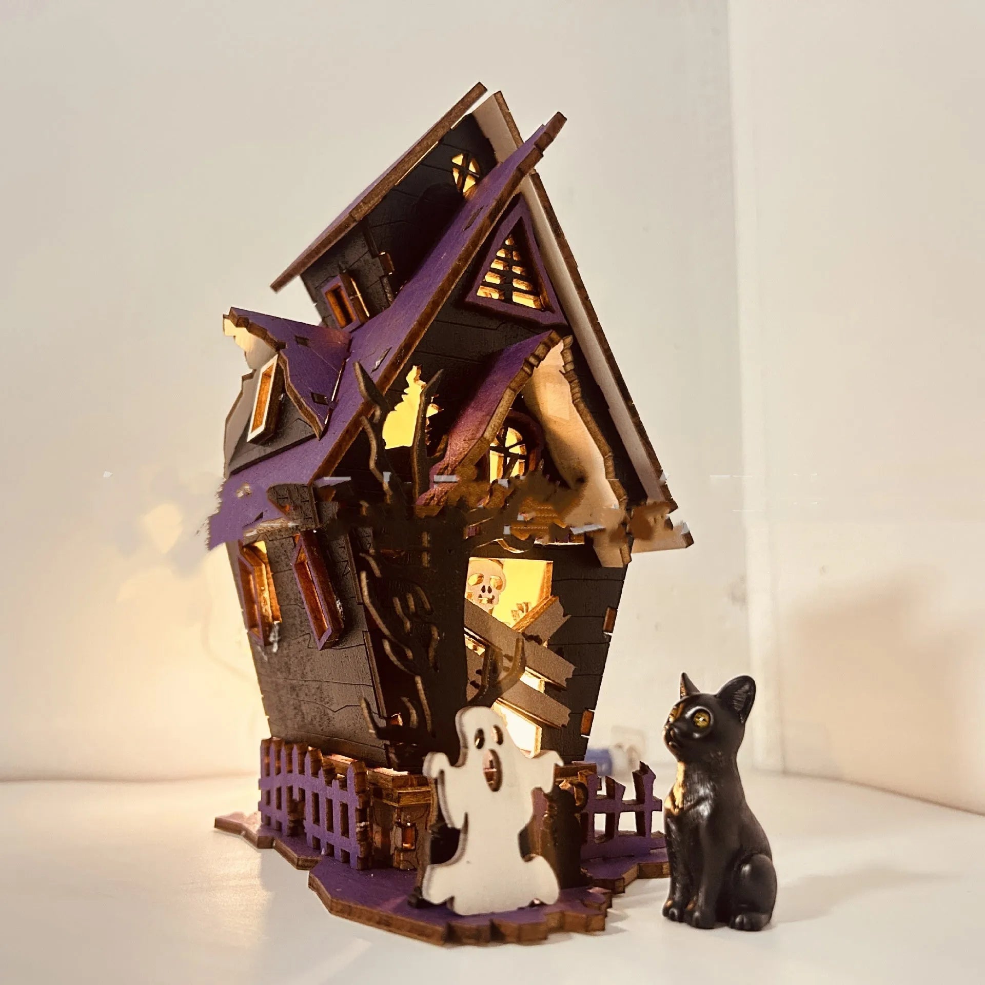 Wooden Halloween haunted house table decoration with luminous glowing design measuring 14 cm wide