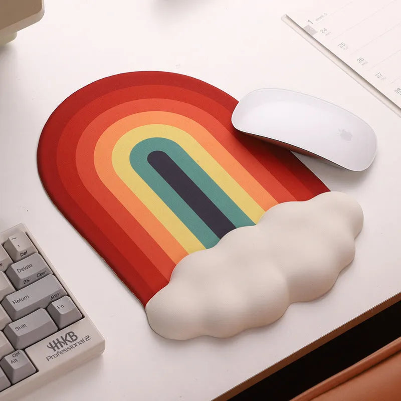 Silicone gel wrister mouse pad and keyboard support set with white cloud pattern on a desk.