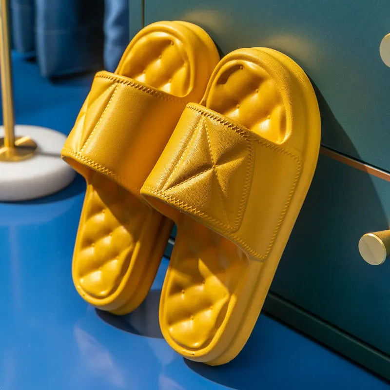 A pair of thick-soled EVA foam bath sandals in a chosen colour, showing the non-slip sole pattern.