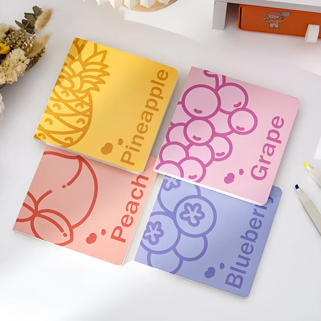 Square fruit notebook with colourful embossed pineapple design cover measuring 14.5cm