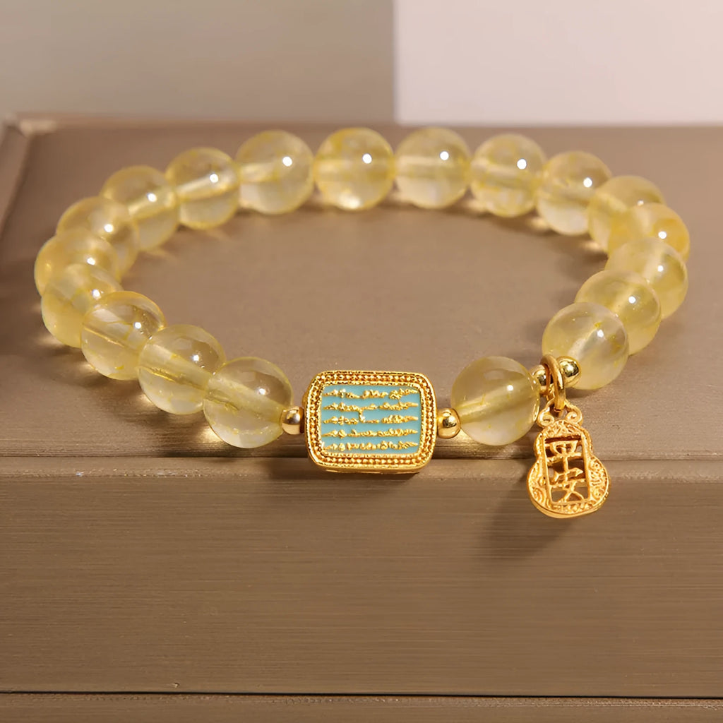 Women's natural yellow citrine crystal bracelet with decorative rhinestone elements