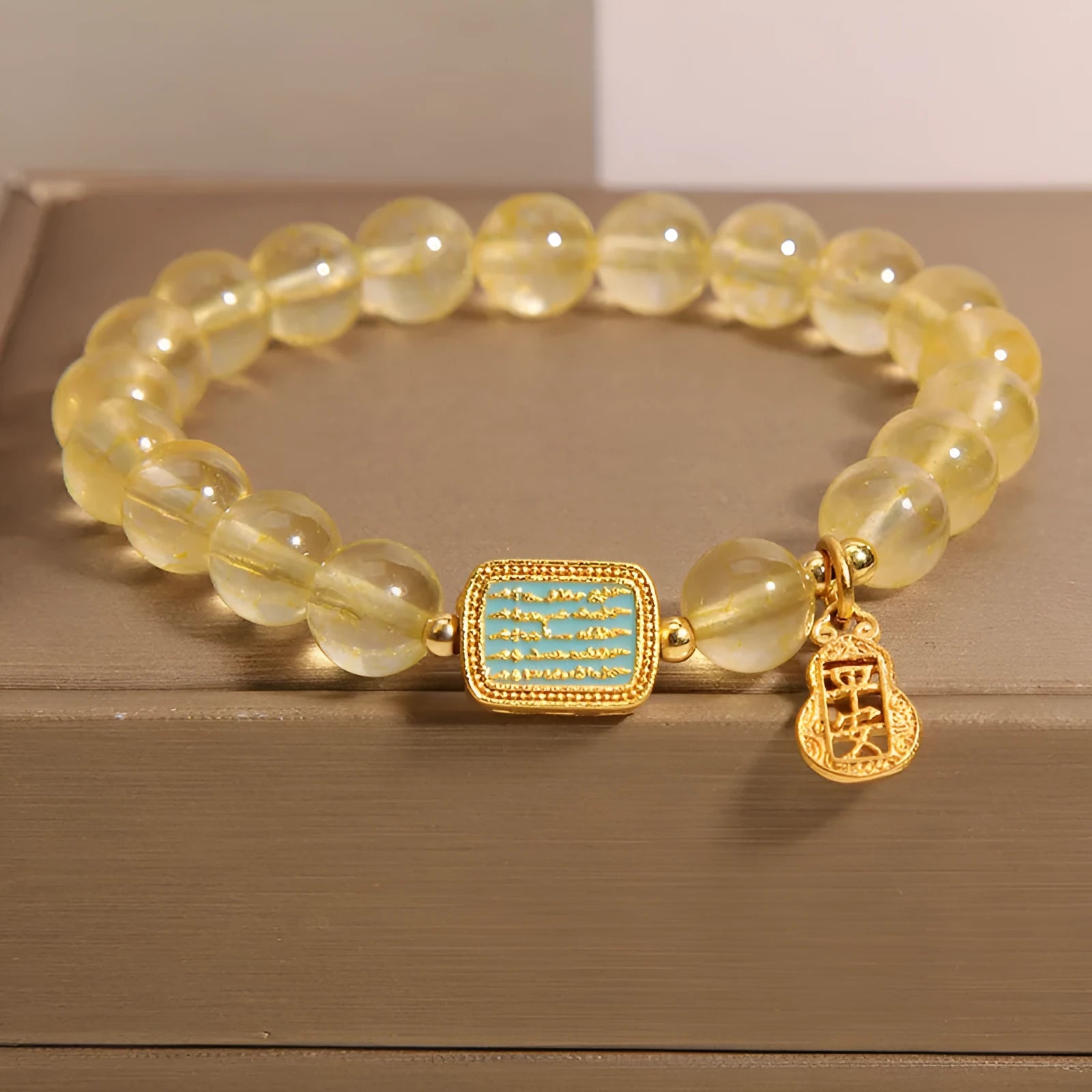 Women's natural yellow citrine crystal bracelet with decorative rhinestone elements