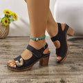 A pair of light brown Roman-style sandals with a round toe and a single Velcro closure strap.