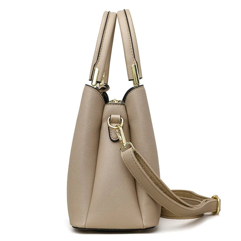 Women's black PU leather messenger bag with multi-layer interior compartments and a shoulder strap