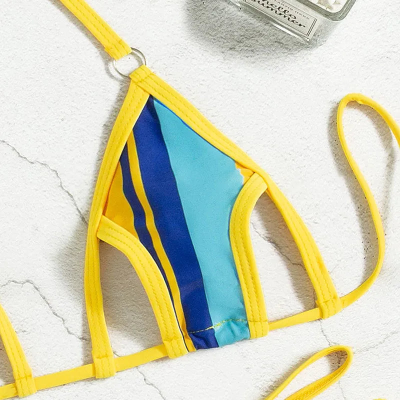 Yellow women's one-piece swimsuit with a neck-hanging strap and backless hollow design.