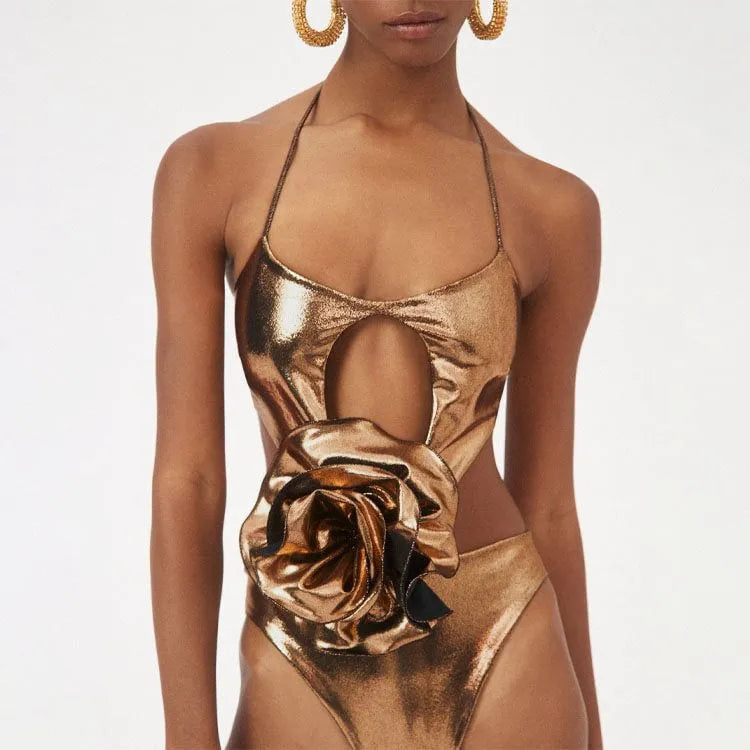 Gold coloured halter neck one piece swimsuit with a handmade hollow out flower design on the front.