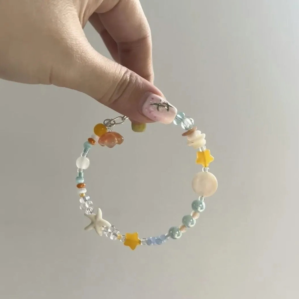 Orange mixed material diamond-shaped women's bracelet with round design elements