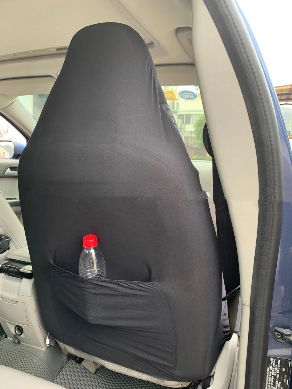 Black quilted universal car seat cover made from PU and polyester fabric.