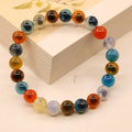 Women's geometric bracelet with colourful sugar heart agate beads and a detailed copper coin snake chain.