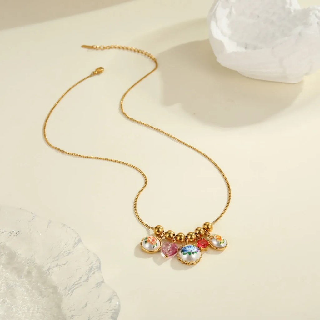 Vintage sunflower stainless steel necklace with 18K gold electroplated finish on display