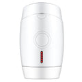 White home laser hair removal handset unit with display, shown next to its power adapter.