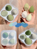 Makeup egg box open showing four coloured synthetic sponge beauty eggs in grape, mango, mint and peach peach.