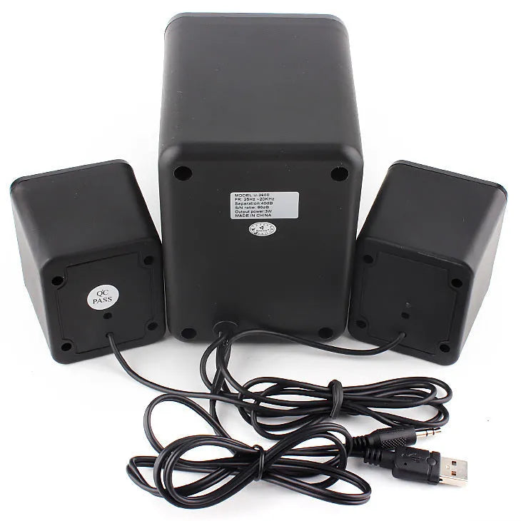 Green USB computer speaker with colourful glowing lights showing USB and audio jack ports