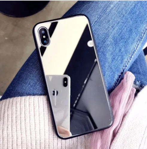 Black iPhone mirror phone case showing reflective back surface, compatible with multiple iPhone models.