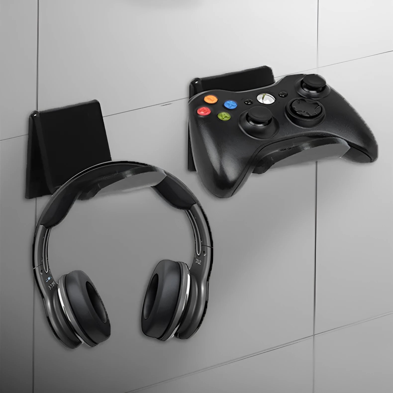 Universal plastic wall mount bracket holding a game controller, shown in black, white, and transparent colour options.