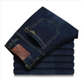 Men's elastic business straight jeans in 8151 blue wash with worn white finish, zipper fly, and pocket details