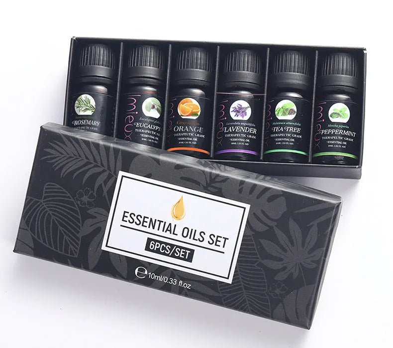 Six 10ml essential oil bottles in a row – tea tree, mint, sweet orange, eucalyptus, rosemary, lavender