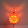 Plastic pumpkin lamp with USB charging port displaying yellow or purple light option