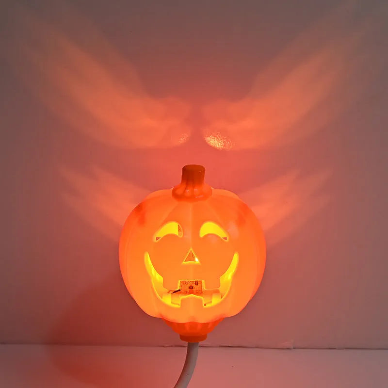Plastic pumpkin lamp with USB charging port displaying yellow or purple light option