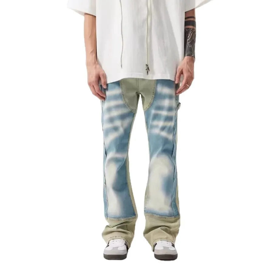Retro jeans featuring yellow and blue patchwork splash-ink damaged design on non-stretch denim.
