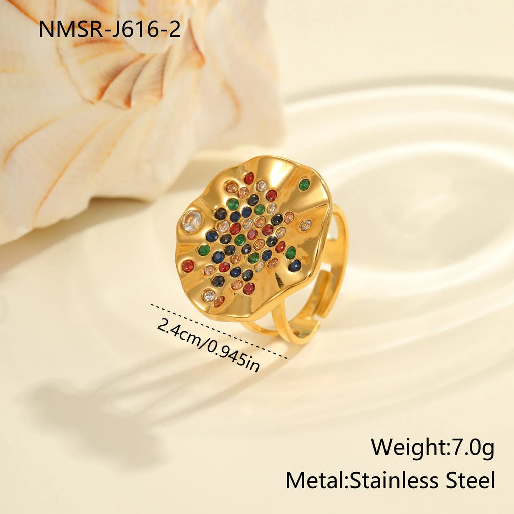 Geometric pleated inlaid colour diamond titanium steel ring on a hand, showing open mouth adjustable design.