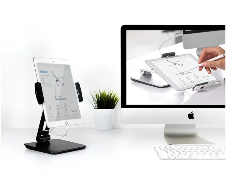 Silver folding aluminium phone and tablet stand with 360-degree rotation on desktop