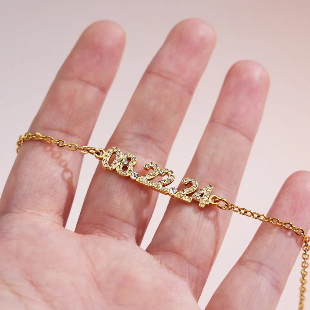 Stainless steel digital bracelet with diamond-set numbers on display, shown in rose gold finish.