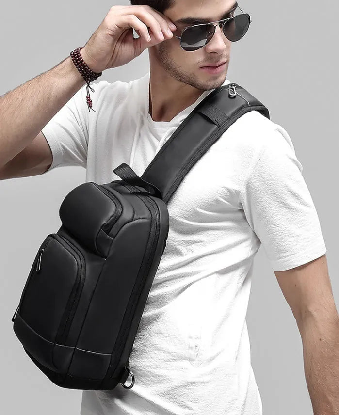 Black PVC outdoor leisure shoulder bag with air cushion strap and internal organisers