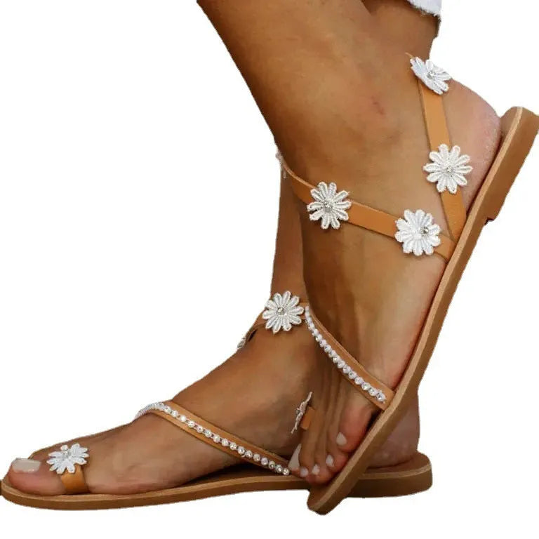 Brown women's Roman sandals with flower pattern and herringbone toe design
