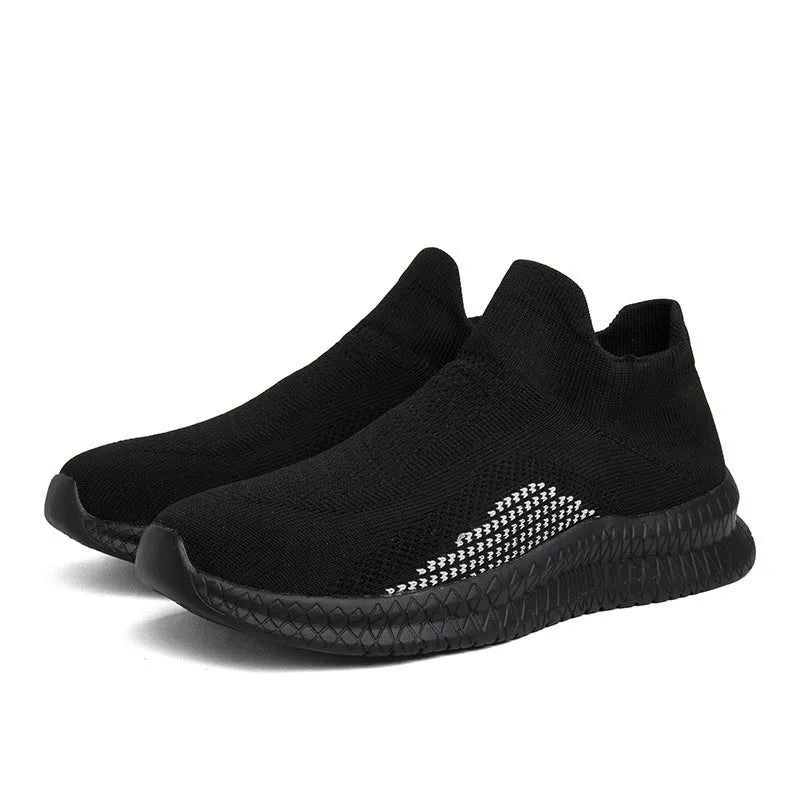 Men's white low-top fabric casual sneakers with a flat heel and round toe on a plain background.