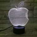 Colourful 3D fruit shaped acrylic LED night light with touch control on a table.