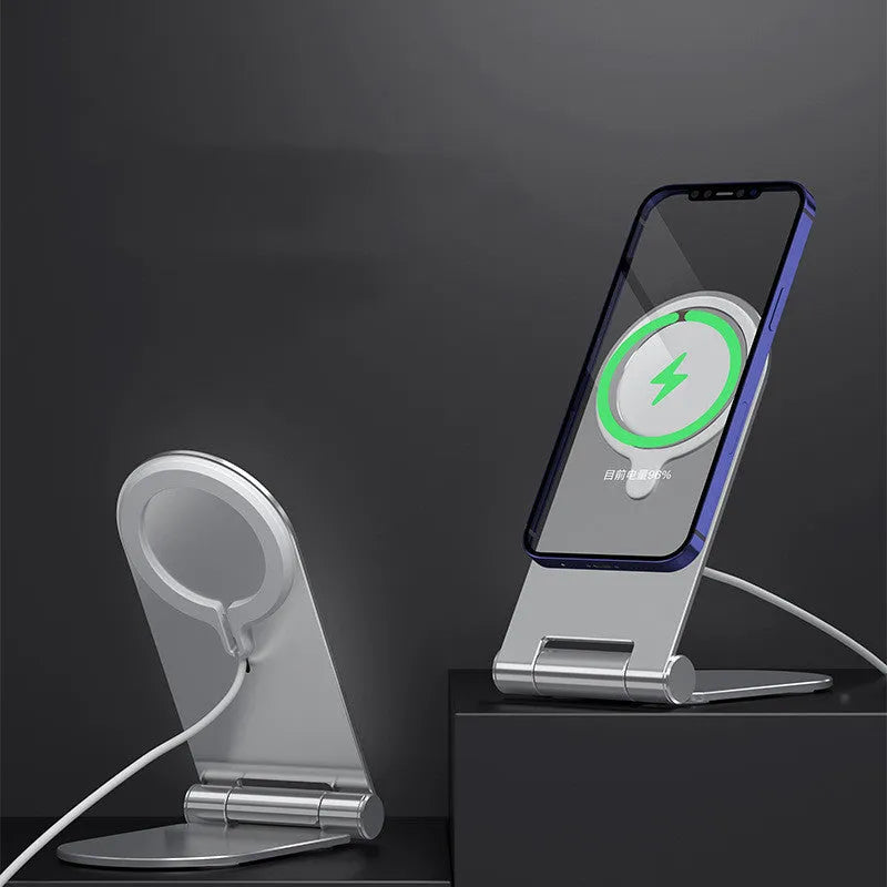 Silver vertical adjustable magnetic phone bracket on a desk, holding an iPhone 12.
