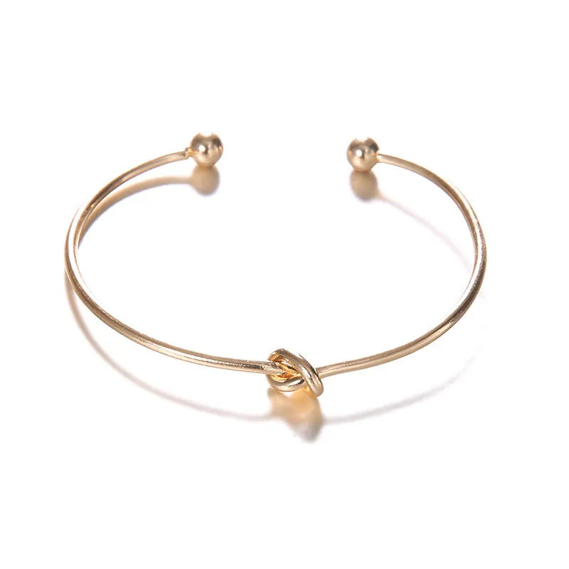 Gold vintage arrow knot cuff bracelet for women with electroplated alloy construction