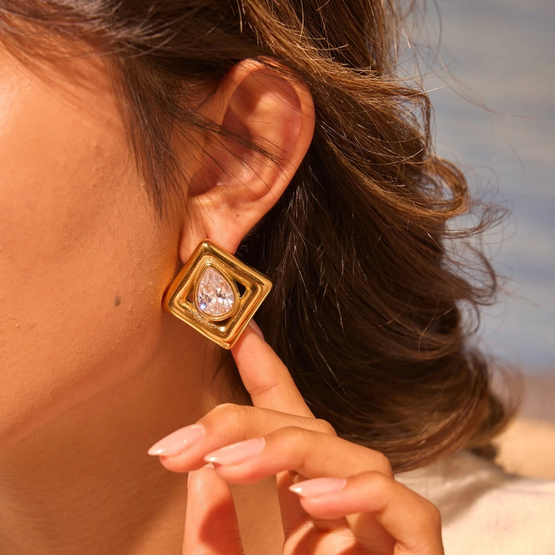 Geometric gold stud earrings with water drop zircon stones on stainless steel
