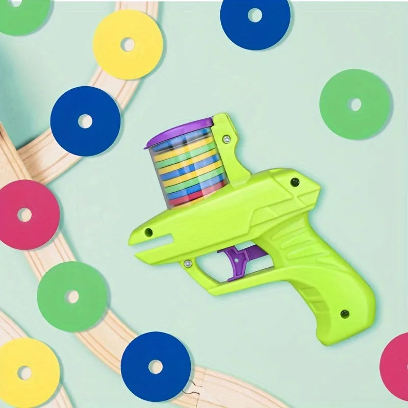 Green durable plastic cat toy launcher with a foam disc ready for launch.