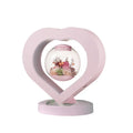 Pink preserved real rose ornament in a decorative case with optional base and Bluetooth speaker.