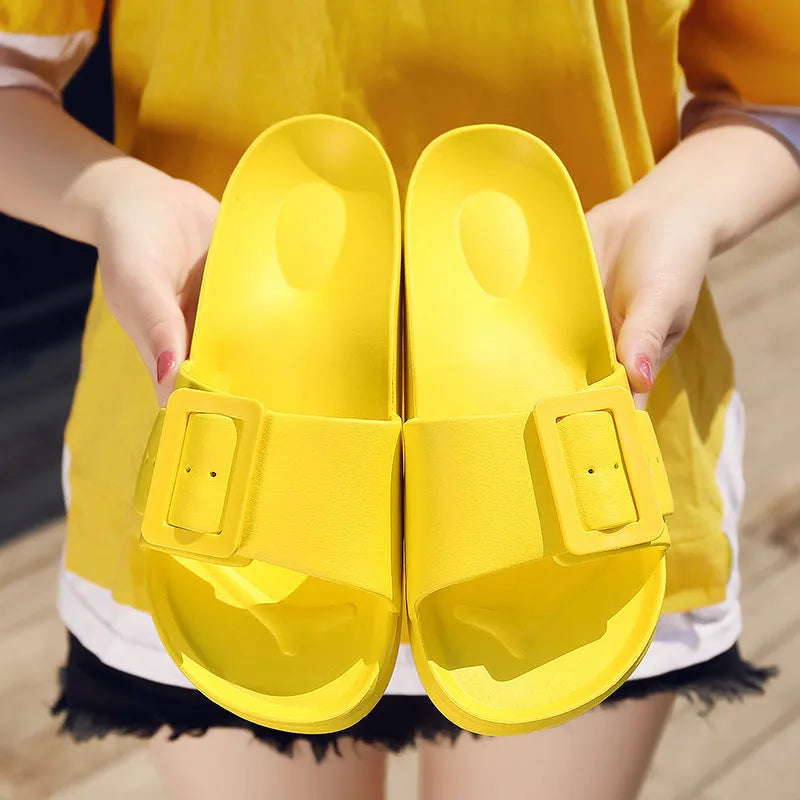 Women's grey blue flip-flop sandals with an adjustable buckle on the strap and a soft EVA sole.