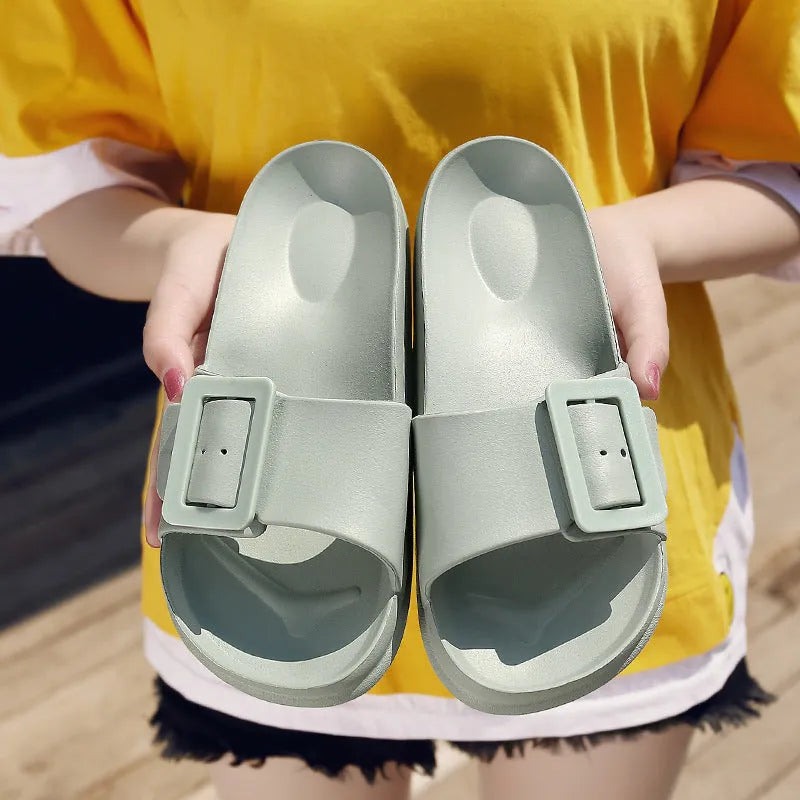 Women's grey blue flip-flop sandals with an adjustable buckle on the strap and a soft EVA sole.