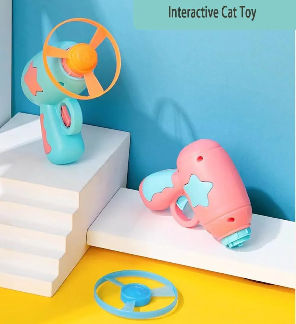 Blue plastic cat toy gun with spinning Frisbee for indoor feline play