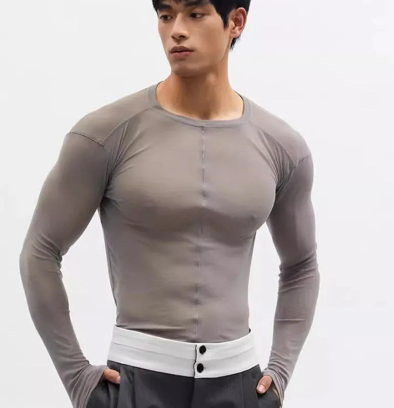 Black mesh slim-fit long sleeve PU pullover top with round neck on a model