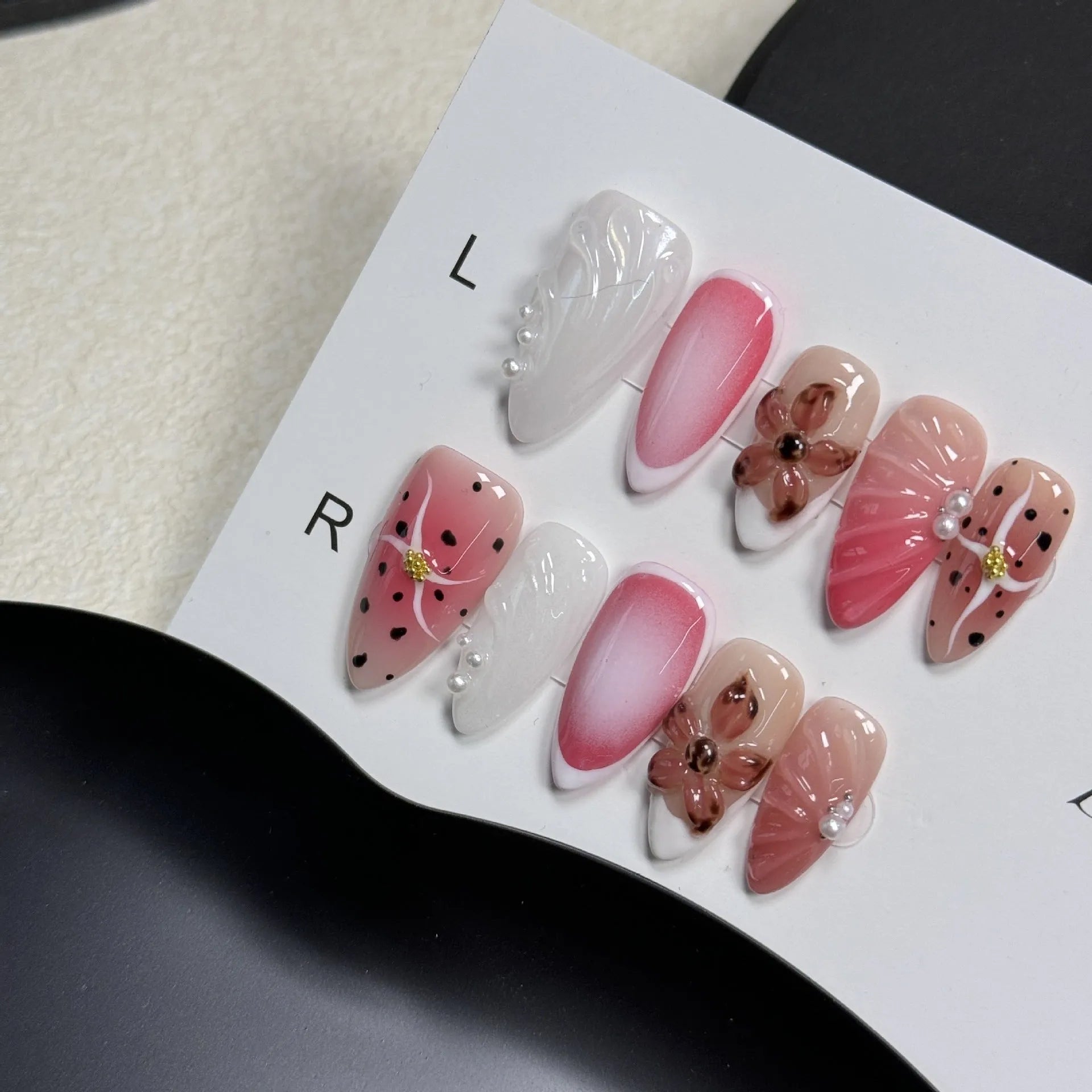 Hand-painted 3D carved nail beauty patches in candy and retro designs on almond-shaped plastic bases.