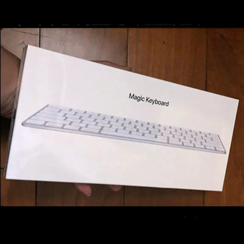 White Apple Bluetooth wireless keyboard with ultra-thin metal construction and multimedia keys